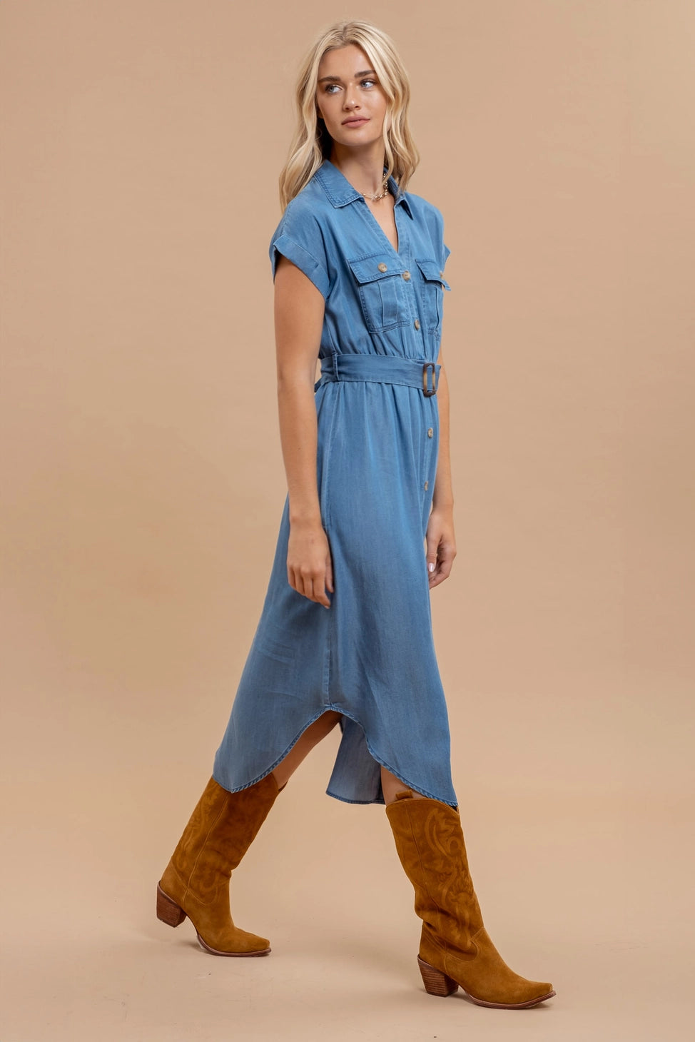 Woman wearing chambray button down belted midi dress with short sleeves and pockets