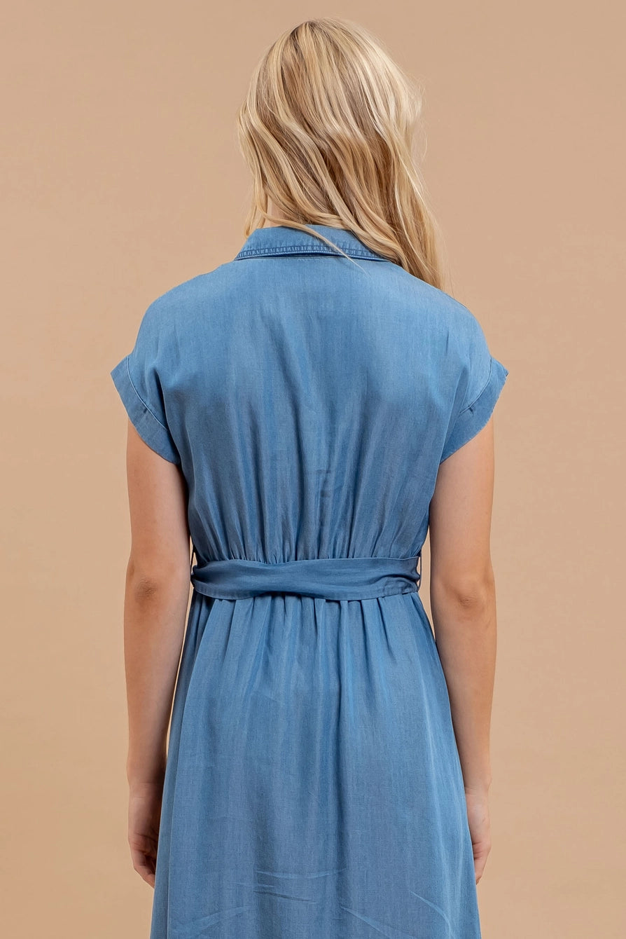 Woman wearing chambray button down belted midi dress with short sleeves and pockets
