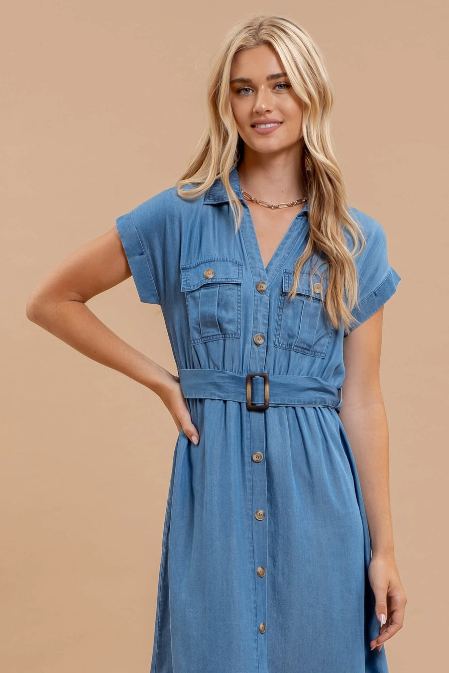 Woman wearing chambray button down belted midi dress with short sleeves and pockets