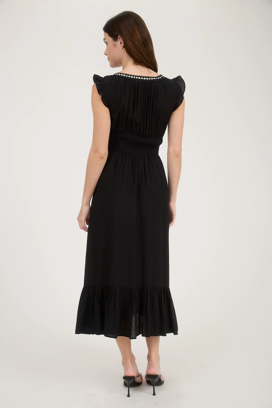 Back of black ruffle midi dress with smocked waist and flutter sleeve detail